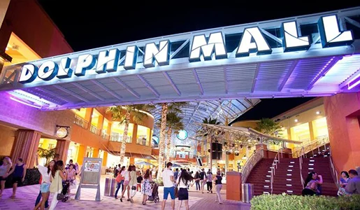 Nighttime entrance of Dolphin Mall, Miami.